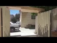 درب اتوماتیک لولایی  با جک بلانکو ساختمان آقای حسینی خیابان شیخ صدوق شمالی