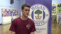 COMMUNITY: Wigan Athletic players Jordy Hiwula and Jason Pearce join in with Schools Sports session