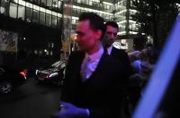 Tom Hiddleston kissing a fan's hand