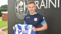 LEE EVANS: Midfielder excited to start working under Paul Cook