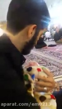 فیلمی دیده نشده از شهید حججی و فرزندش در حرم امام رضا ع
